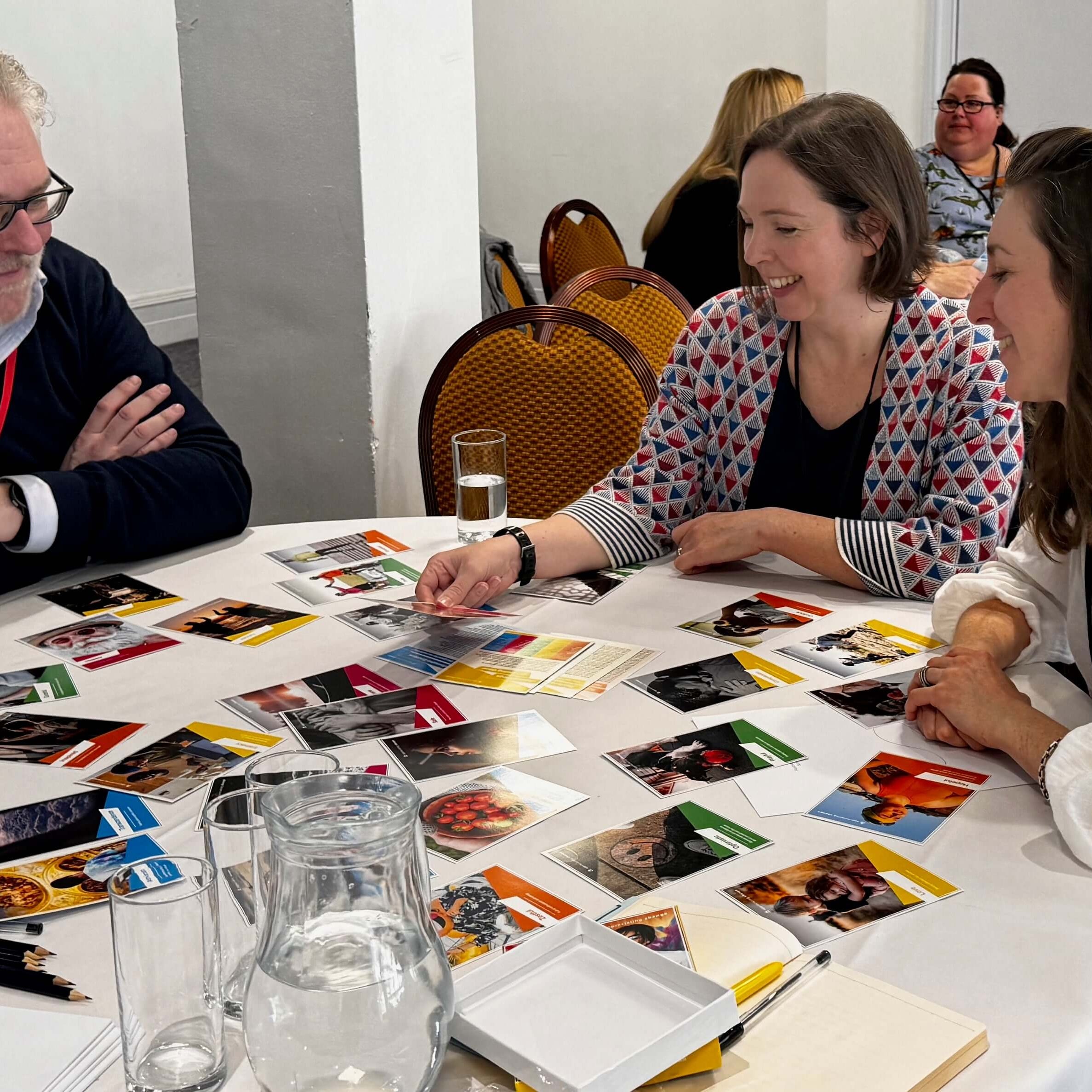 photo of People using positive emotion cards