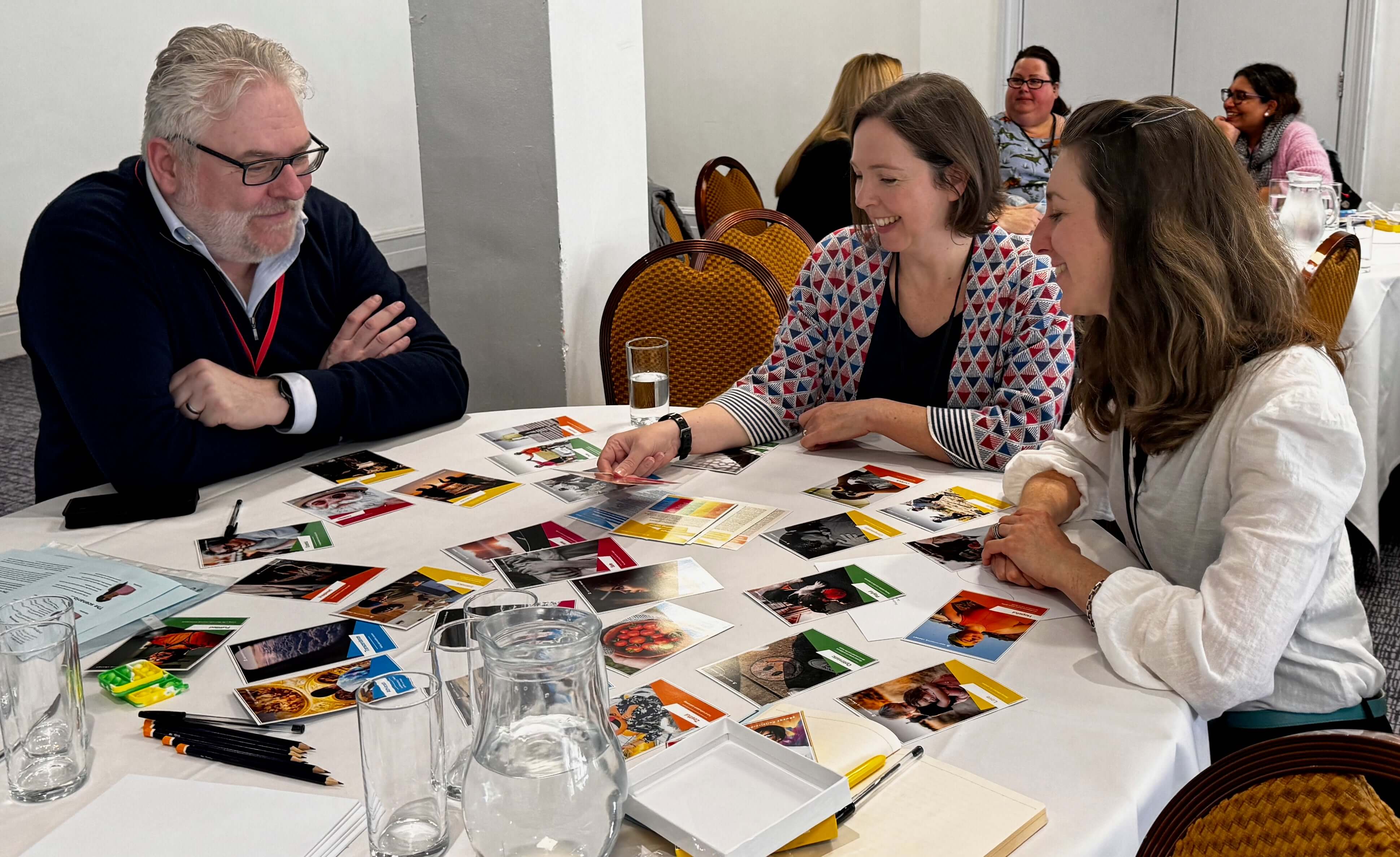 photo of People using positive emotion cards